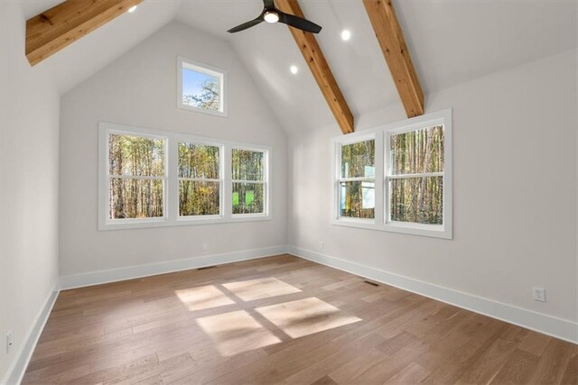 bonus room featuring ceiling fan, light hardwood / wood-style flooring, beamed ceiling, and high vaulted ceiling