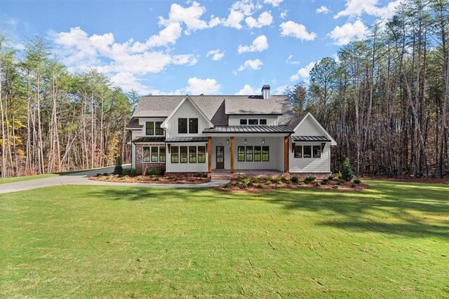 view of front of property with a front lawn and a porch