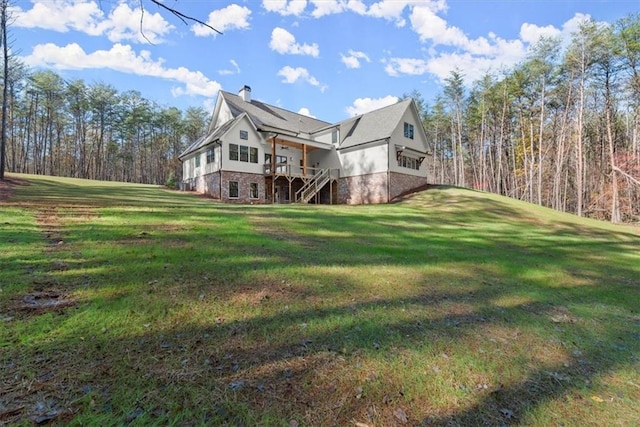 view of side of home featuring a yard