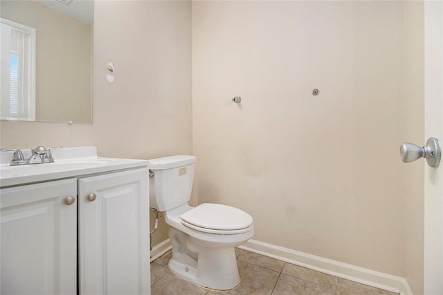 bathroom with tile patterned floors, toilet, and vanity