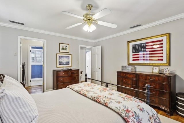 bedroom with ceiling fan, dark hardwood / wood-style flooring, and ornamental molding