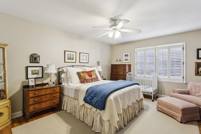 bedroom with hardwood / wood-style flooring and ceiling fan