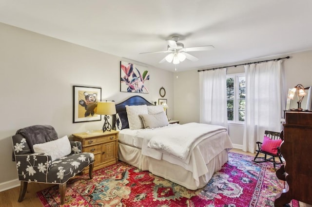 bedroom featuring ceiling fan and light hardwood / wood-style flooring