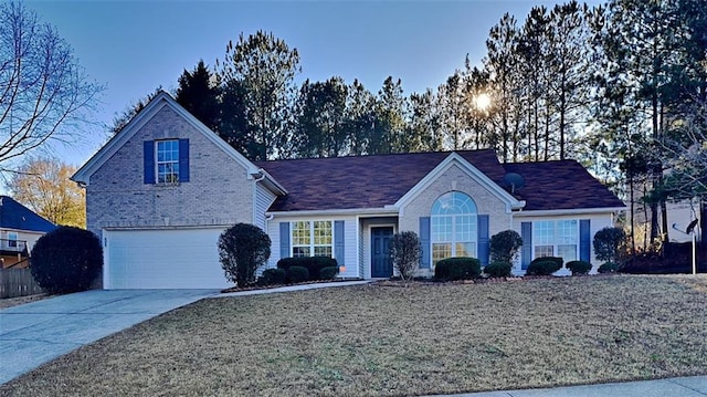 view of property with a front yard and a garage