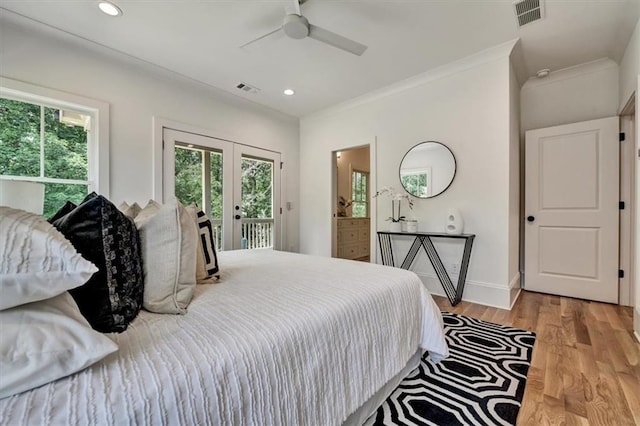 bedroom with access to exterior, ceiling fan, french doors, crown molding, and light hardwood / wood-style floors