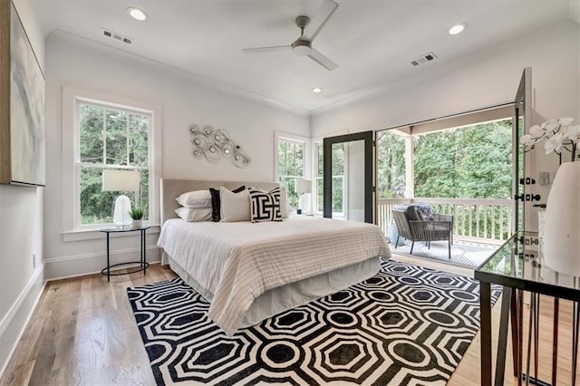 bedroom featuring access to exterior, ceiling fan, and light hardwood / wood-style floors