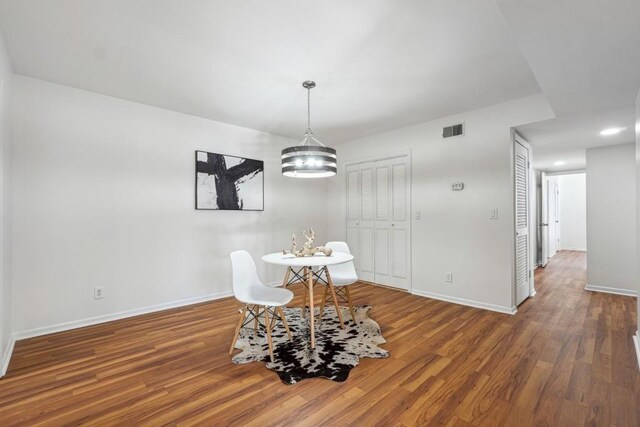 6851 Roswell Rd Unit N-20, Sandy Springs, GA 30328 - dining area featuring baseboards, wood finished floors, and a chandelier