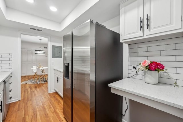 6851 Roswell Rd Unit N-20, Sandy Springs, GA 30328 - kitchen featuring stainless steel refrigerator with ice dispenser, light wood-type flooring, white cabinetry, light stone countertops, and recessed lighting