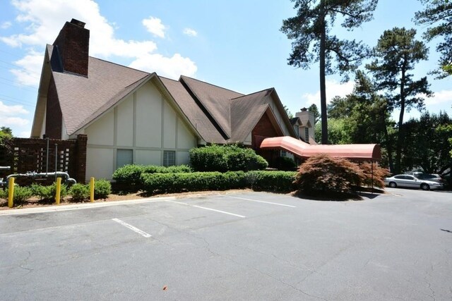 6851 Roswell Rd Unit N-20, Sandy Springs, GA 30328 - view of property with uncovered parking