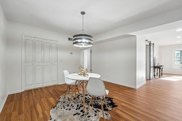 6851 Roswell Rd Unit N-20, Sandy Springs, GA 30328 - dining area with wood finished floors, baseboards, and a chandelier