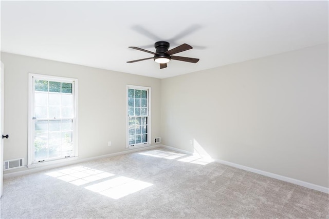 carpeted empty room with ceiling fan