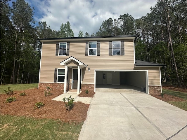 view of front of house with concrete driveway, a garage, and brick siding