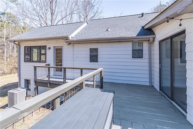 wooden terrace featuring central air condition unit