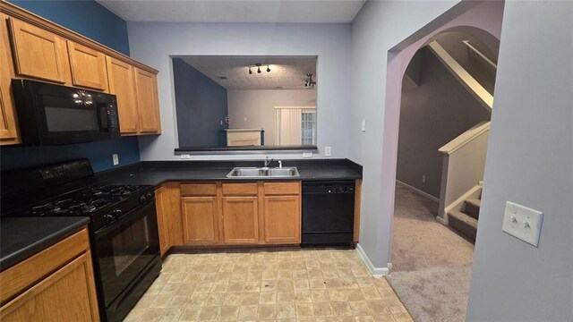 kitchen with sink, light colored carpet, and black appliances