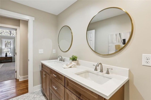 645 Trailmore Pl, Roswell, GA 30076 - bathroom featuring double vanity, a sink, and baseboards