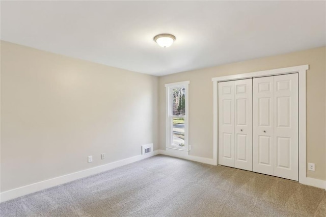 645 Trailmore Pl, Roswell, GA 30076 - unfurnished bedroom featuring baseboards, visible vents, a closet, and carpet