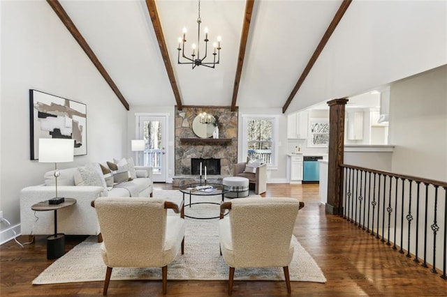 645 Trailmore Pl, Roswell, GA 30076 - living area featuring high vaulted ceiling, beamed ceiling, a stone fireplace, dark wood-type flooring, and a notable chandelier
