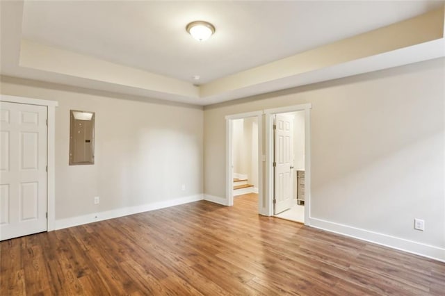 645 Trailmore Pl, Roswell, GA 30076 - spare room featuring baseboards, wood finished floors, and electric panel