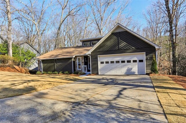 645 Trailmore Pl, Roswell, GA 30076 - view of front of property with driveway and a garage