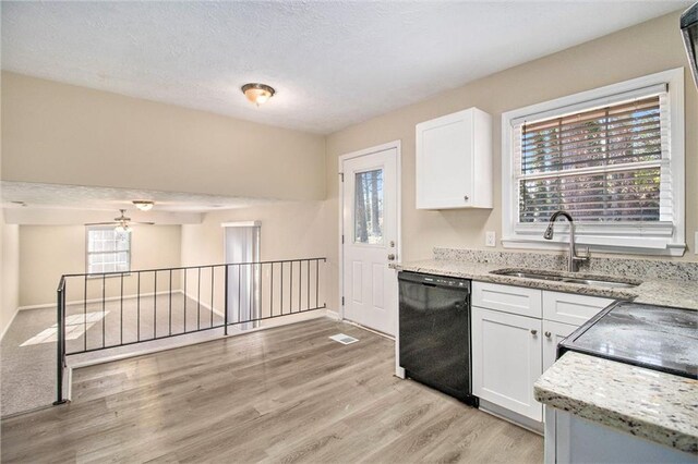 kitchen featuring dishwasher, white cabinets, ceiling fan, and sink