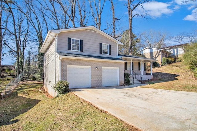 view of front facade with a front yard, a porch, and a garage