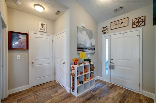 504 Cole Creek Dr, Dallas, GA 30157 - foyer entrance featuring wood finished floors, a textured ceiling, and baseboards