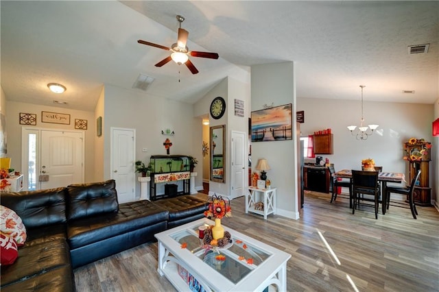 504 Cole Creek Dr, Dallas, GA 30157 - living area featuring a chandelier, wood finished floors, ceiling fan, vaulted ceiling, and baseboards