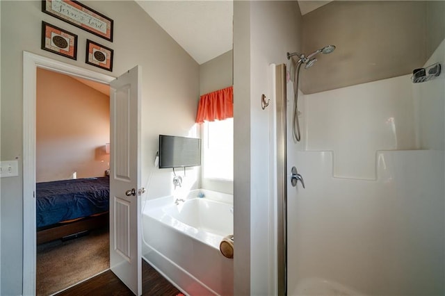 504 Cole Creek Dr, Dallas, GA 30157 - bathroom with a garden tub, a stall shower, wood finished floors, ensuite bathroom, and lofted ceiling