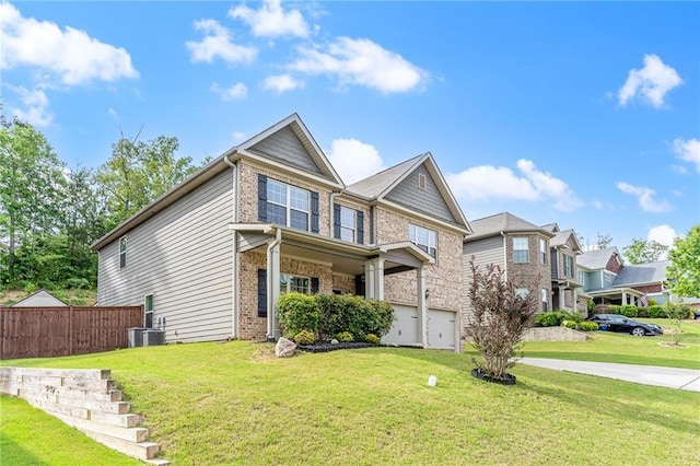 view of front of home with a front yard and a garage