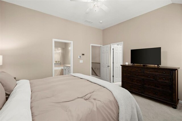2303 Waters Edge Trl, Roswell, GA 30075 - bedroom with light carpet, ensuite bath, and a ceiling fan