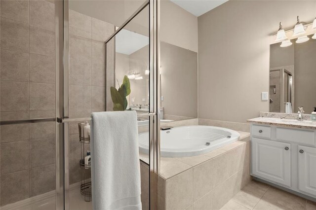 2303 Waters Edge Trl, Roswell, GA 30075 - full bath with a stall shower, a bath, vanity, and tile patterned floors