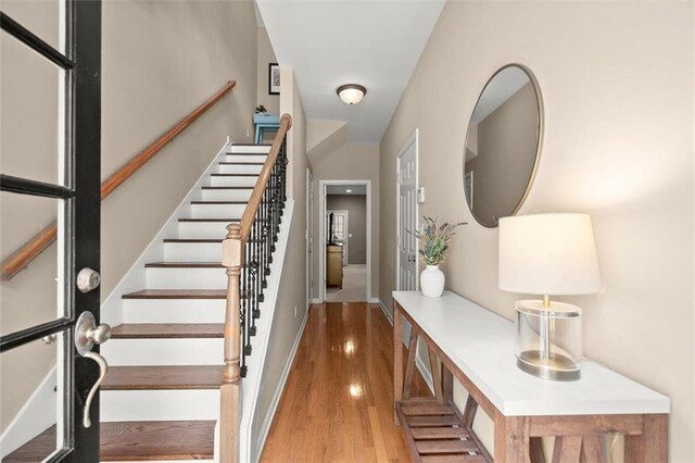 2303 Waters Edge Trl, Roswell, GA 30075 - foyer featuring stairway, wood finished floors, and baseboards