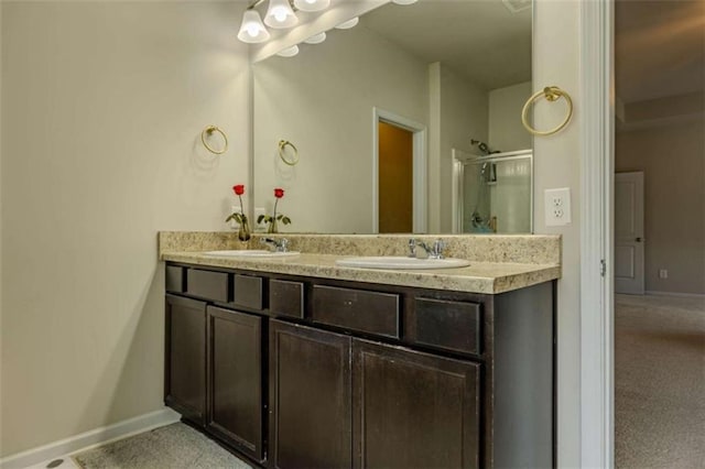 bathroom featuring walk in shower and vanity