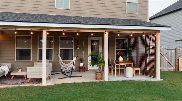 back of house featuring a yard and a patio