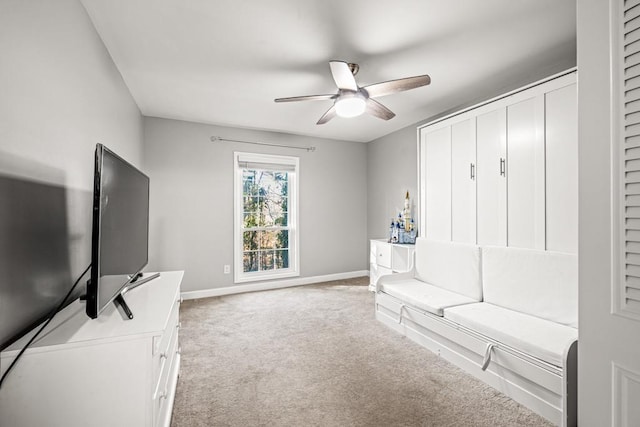 living room with light colored carpet and ceiling fan