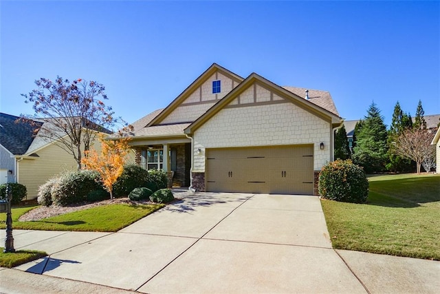 craftsman-style house featuring a front yard and a garage