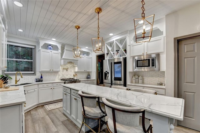 127 Bradshaw Park Dr, Woodstock, GA 30188 - kitchen with stainless steel appliances, custom range hood, decorative backsplash, white cabinetry, and recessed lighting