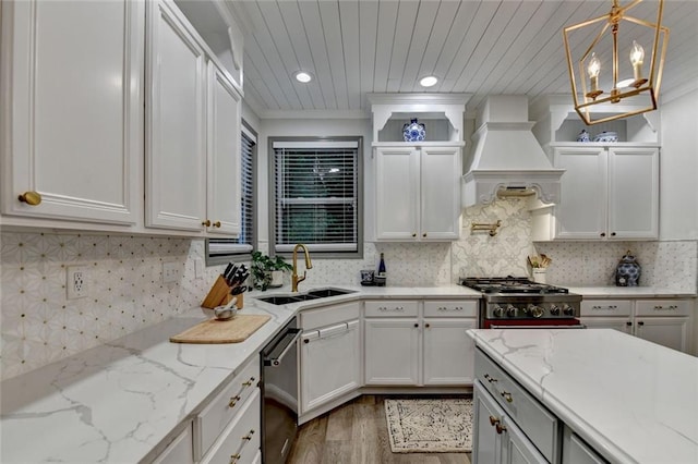 127 Bradshaw Park Dr, Woodstock, GA 30188 - kitchen featuring wood finished floors, stove, custom exhaust hood, dishwasher, and white cabinetry