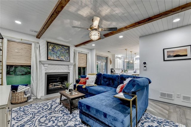 127 Bradshaw Park Dr, Woodstock, GA 30188 - living area featuring beam ceiling, wood finished floors, recessed lighting, a fireplace with flush hearth, and ceiling fan
