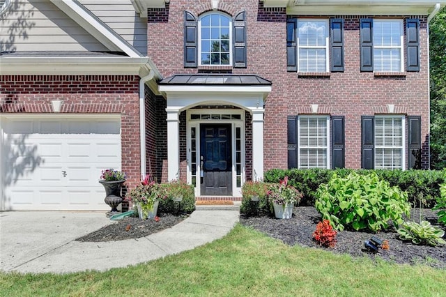 127 Bradshaw Park Dr, Woodstock, GA 30188 - entrance to property with brick siding, a garage, and driveway