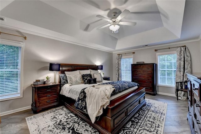 127 Bradshaw Park Dr, Woodstock, GA 30188 - bedroom featuring a raised ceiling, a ceiling fan, and wood finished floors