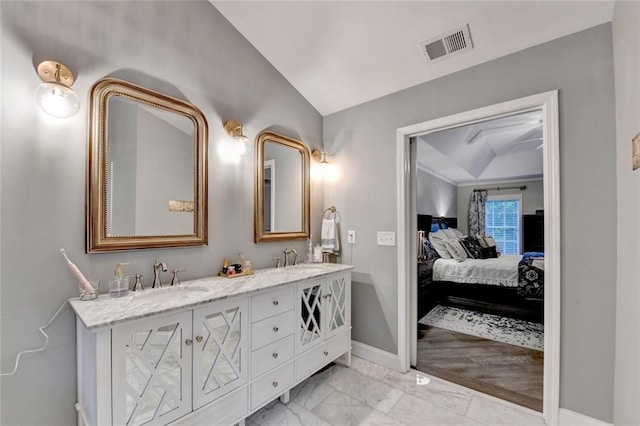127 Bradshaw Park Dr, Woodstock, GA 30188 - ensuite bathroom featuring double vanity, lofted ceiling, and marble finish floors