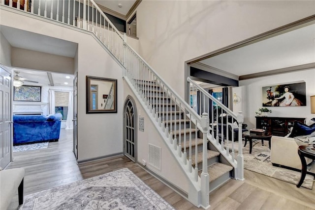 127 Bradshaw Park Dr, Woodstock, GA 30188 - stairway featuring wood finished floors and a towering ceiling
