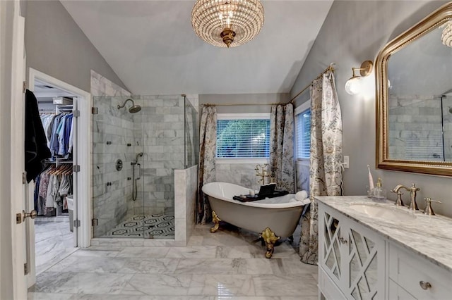 127 Bradshaw Park Dr, Woodstock, GA 30188 - bathroom featuring vaulted ceiling, a stall shower, a freestanding bath, vanity, and a spacious closet