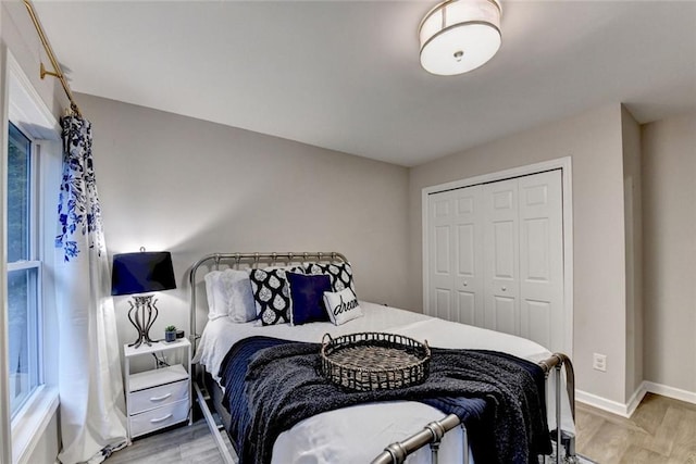 127 Bradshaw Park Dr, Woodstock, GA 30188 - bedroom featuring a closet and light wood-style floors