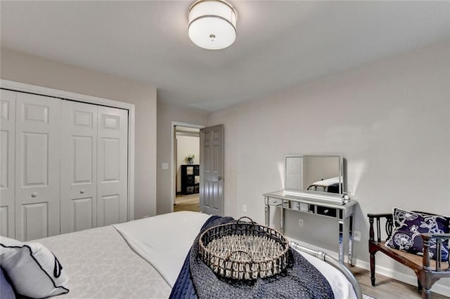 127 Bradshaw Park Dr, Woodstock, GA 30188 - bedroom featuring a closet and wood finished floors
