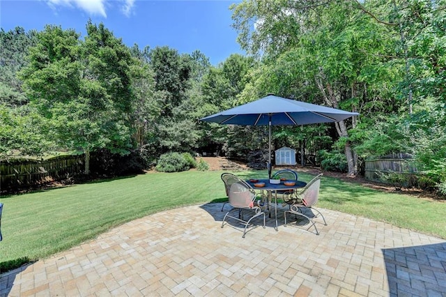 127 Bradshaw Park Dr, Woodstock, GA 30188 - fenced backyard featuring a shed, outdoor dining space, and a patio area