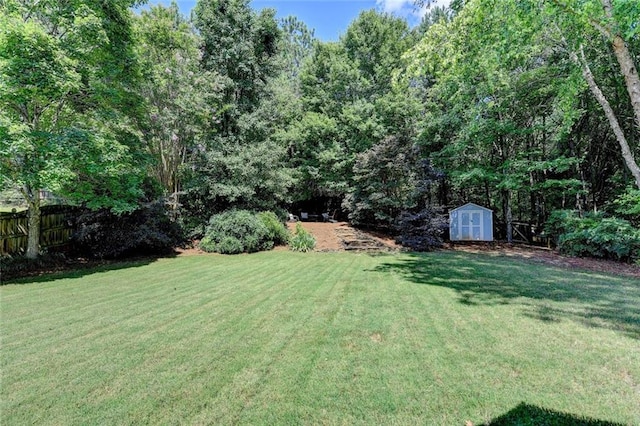 127 Bradshaw Park Dr, Woodstock, GA 30188 - view of yard with a storage unit