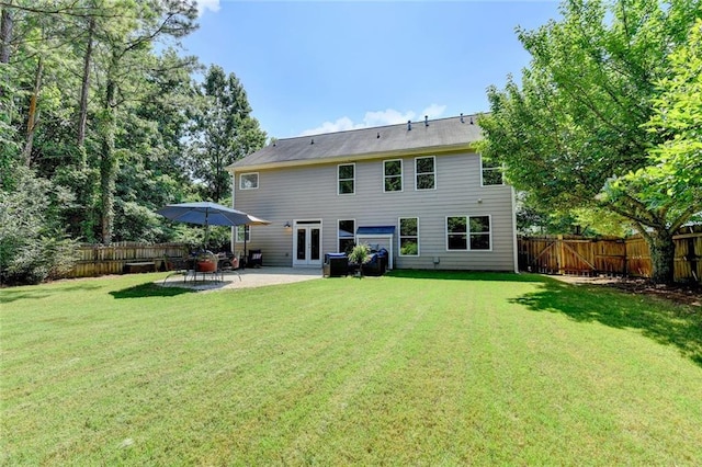 127 Bradshaw Park Dr, Woodstock, GA 30188 - back of property with french doors, a fenced backyard, and a patio