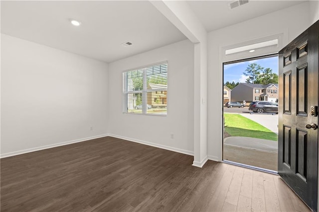 entrance foyer featuring dark wood-style floors, visible vents, recessed lighting, and baseboards